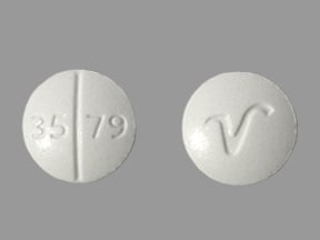 This medicine is a white, round, scored tablet imprinted with "35 79&q...