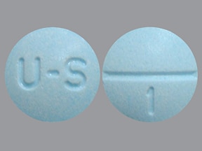 This medicine is a light blue, round, scored tablet imprinted with "U-...